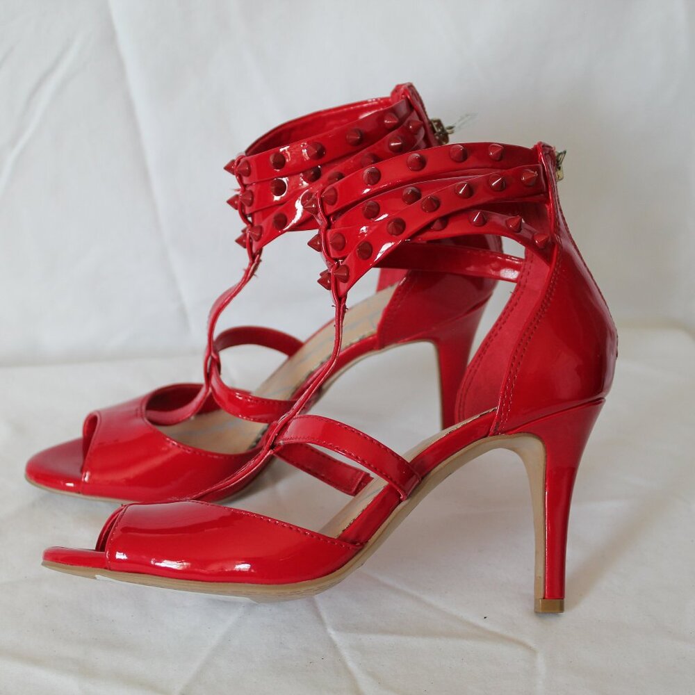 gloss red strappy heels. 6.5 US 4 inch heel